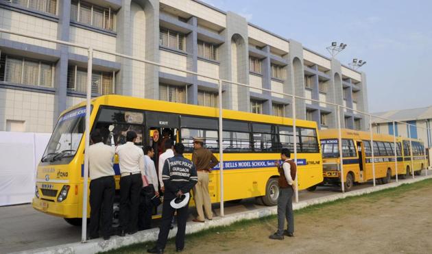 Traffic and transport officials inspect buses of Blue Bells Model School in Sector 4 on Thursday.(Parveen Kumar/HT)