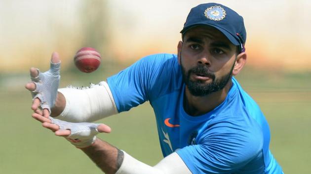 Indian Test cricket captain Virat Kohli takes a catch during a practice session. (AFP) Indian Test cricket captain Virat Kohli takes a catch during a practice session. (AFP)