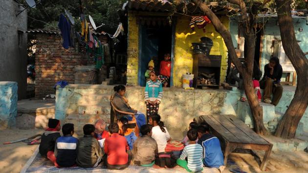 A tuition centre operating in a slum in Noida. The teachers, Rakhi and Nisha, who run it, hope to be able to transform it into a proper school with government help. At times, both parents work multiple jobs, and children are left to their own devices. Informal neighbourhood schools step in when government schools are unavailable or ineffective. (Burhaan Kinu/HT PHOTO) A tuition centre operating in a slum in Noida. The teachers, Rakhi and Nisha, who run it, hope to be able to transform it into a proper school with government help. At times, both parents work multiple jobs, and children are left to their own devices. Informal neighbourhood schools step in when government schools are unavailable or ineffective. (Burhaan Kinu/HT PHOTO)