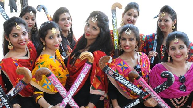 Bold and beautiful: College students holding hockeys as a symbol of empowerment during the college fest. (Anil Dayal/HT Photo )