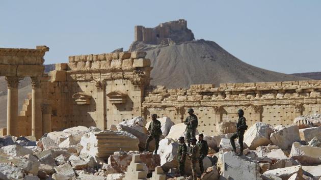 Syrian army soldiers stand on the ruins of the Temple of Bel in the historic city of Palmyra, in Homs Governorate, Syria April 1, 2016. (REUTERS File Photo) Syrian army soldiers stand on the ruins of the Temple of Bel in the historic city of Palmyra, in Homs Governorate, Syria April 1, 2016. (REUTERS File Photo)
