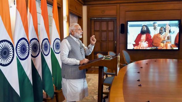 Prime Minister Narendra Modi addresses the inaugural function of the International Yoga Festival at Rishikesh through video conferencing in New Delhi on Thursday. (PTI) Prime Minister Narendra Modi addresses the inaugural function of the International Yoga Festival at Rishikesh through video conferencing in New Delhi on Thursday. (PTI)