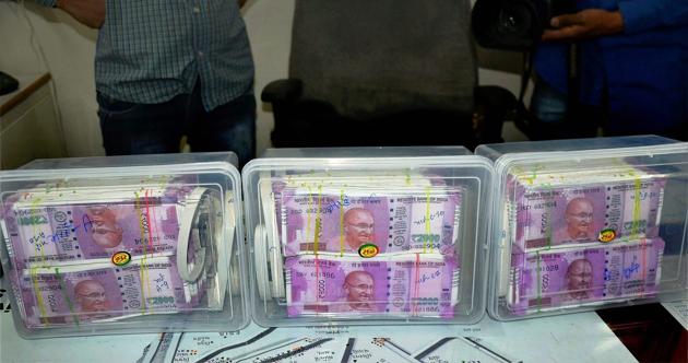 Rajkot : Police seize fake Rs 2,000 notes at Rajkot City on Saturday. PTI Photo(PTI2_25_2017_000156B) (PTI) Rajkot : Police seize fake Rs 2,000 notes at Rajkot City on Saturday. PTI Photo(PTI2_25_2017_000156B) (PTI)