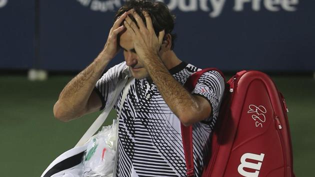 Roger Federer gestures as he leaves the court after losing to Evgeny Donskoy at Dubai Tennis Championships.(AP)