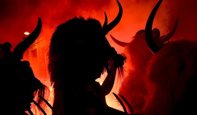'Momotxorros' take part in the carnival wearing typical carnival dress, in Alsasua, northern Spain. Momotxorro, characters who seem to have been resurrected from a prehistoric ritual, come out onto the streets wearing horns and hiding their faces under headscarves, and dressed in a white sheet stained with blood. (Alvaro Barrientos/AP) 'Momotxorros' take part in the carnival wearing typical carnival dress, in Alsasua, northern Spain. Momotxorro, characters who seem to have been resurrected from a prehistoric ritual, come out onto the streets wearing horns and hiding their faces under headscarves, and dressed in a white sheet stained with blood. (Alvaro Barrientos/AP)