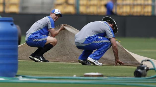 Australia's Steve O'Keefe, left, and Mitchell Marsh check out the Chinnaswamy Stadium pitch in Bangalore on Wednesday. The second India vs Australia Test starts in Bangalore on Saturday. (AP) Australia's Steve O'Keefe, left, and Mitchell Marsh check out the Chinnaswamy Stadium pitch in Bangalore on Wednesday. The second India vs Australia Test starts in Bangalore on Saturday. (AP)