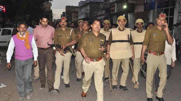 Police officials surveying the situation after the clash in Lakhimpur Kheri.