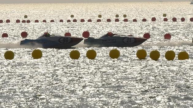 Pilots drive their powerboats through the race course during a qualifying round on Friday. (Anshuman Poyrekar/HT Photo) 