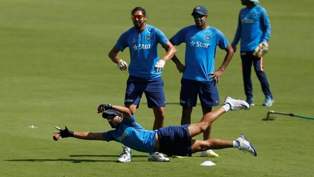 India's Ajinkya Rahane dives to catch a ball during a practice session ahead of their second test match. (REUTERS)