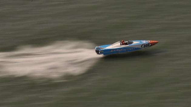 A Panther boat zips past during the qualifier rounds of the NEXA P1 Powerboat race. The Panther boat is a specially designed 28-foot boat that can race in even in six feet of water. (Arijit Sen/HT Photo) 