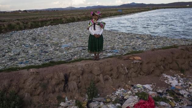 Environmental activist Maruja Inquilla poses for a photo next to a Municipal waste treatment plant with water that flows into Lake Titicaca, in Juliaca, in the Puno region of Peru. "If the frogs could talk they would say,This is killing me, said Inquilla, who recently showed up at the Puno governor's house carrying plastic bags filled with hundreds of dead frogs in protest. (Rodrigo Abd/AP) Environmental activist Maruja Inquilla poses for a photo next to a Municipal waste treatment plant with water that flows into Lake Titicaca, in Juliaca, in the Puno region of Peru. "If the frogs could talk they would say,This is killing me, said Inquilla, who recently showed up at the Puno governor's house carrying plastic bags filled with hundreds of dead frogs in protest. (Rodrigo Abd/AP)