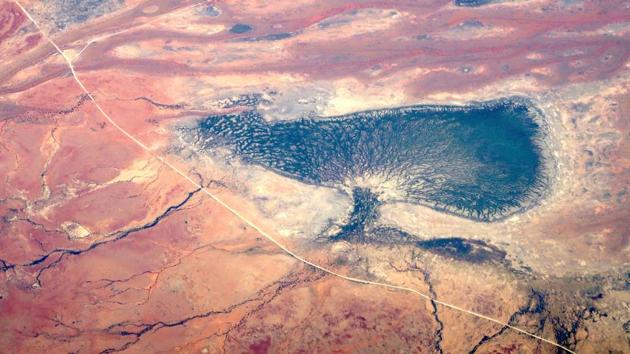 Small dams and a dried-up lake can be seen next to a dirt road in outback Queensland, Australia . (David Gray / REUTERS) Small dams and a dried-up lake can be seen next to a dirt road in outback Queensland, Australia . (David Gray / REUTERS)