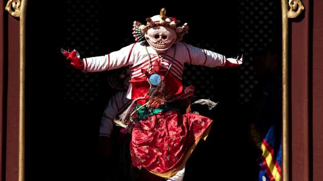 A Tibetan monk dressed as a demon performing a dance for the Beating Ghost festival during a rehearsal at the Yonghe Temple, also known as the Lama Temple, in Beijing. (Fred DUFOUR / AFP) A Tibetan monk dressed as a demon performing a dance for the Beating Ghost festival during a rehearsal at the Yonghe Temple, also known as the Lama Temple, in Beijing. (Fred DUFOUR / AFP)