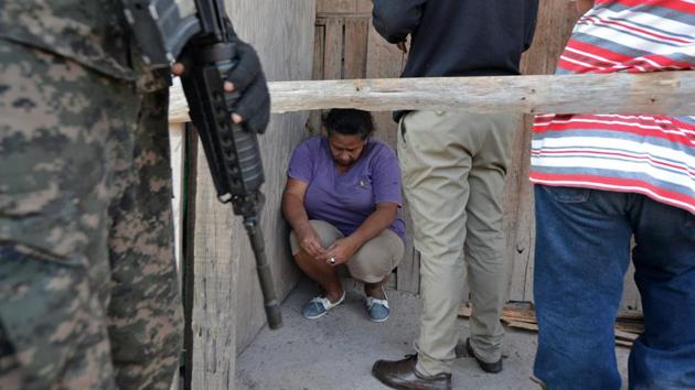 Alleged drug traffickers are arrested by Honduras' Military Police in Tegucigalpa, on February 24, 2017 during a raid as part of Morazan Operation to combat organized crime and insecurity in the country. (Orlando SIERRA / AFP) Alleged drug traffickers are arrested by Honduras' Military Police in Tegucigalpa, on February 24, 2017 during a raid as part of Morazan Operation to combat organized crime and insecurity in the country. (Orlando SIERRA / AFP)