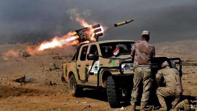 Members of the Iraqi army's 9th Division fire a multiple rocket launcher from a hill in Talul al-Atshana, on the southwestern outskirts of Mosul. (ARIS MESSINIS / AFP) Members of the Iraqi army's 9th Division fire a multiple rocket launcher from a hill in Talul al-Atshana, on the southwestern outskirts of Mosul. (ARIS MESSINIS / AFP)