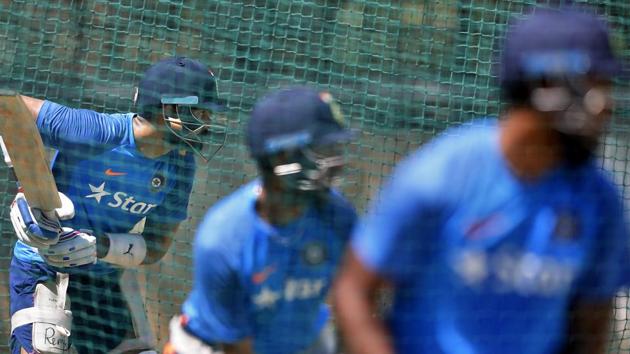 India's captain Virat Kohli, left, and teammates bat in the nets during a training session. (AP)