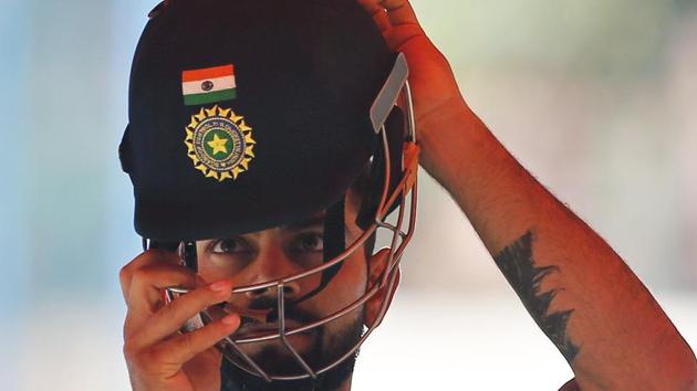 Virat Kohli prepares to bat in the nets during a training session ahead of their second cricket Test match against Australia in Bangalore. (AP) Virat Kohli prepares to bat in the nets during a training session ahead of their second cricket Test match against Australia in Bangalore. (AP)