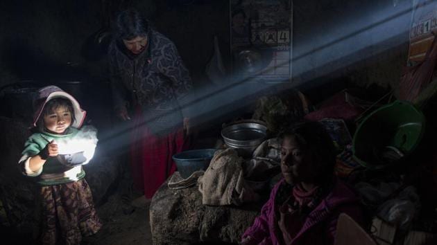A child holds a bowl of hot food as the Avila family has lunch at their home in Coata, a small village on the shore of Lake Titicaca in the Puno region of Peru. Lake Titicaca was once worshipped by Incas who proclaimed its deep blue waters the birthplace of the sun, but today high levels of mercury, cadmium, zinc and copper are found in the fish locals consume, according to a 2014 government study. (Rodrigo Abd/AP) A child holds a bowl of hot food as the Avila family has lunch at their home in Coata, a small village on the shore of Lake Titicaca in the Puno region of Peru. Lake Titicaca was once worshipped by Incas who proclaimed its deep blue waters the birthplace of the sun, but today high levels of mercury, cadmium, zinc and copper are found in the fish locals consume, according to a 2014 government study. (Rodrigo Abd/AP)
