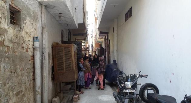 People gather in front of the house of the victim in southwest Delhi’s Bindapur. (HT Photo) People gather in front of the house of the victim in southwest Delhi’s Bindapur. (HT Photo)