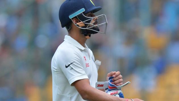 Indian captain Virat Kohli scored only 12 runs before being trapped leg before by Nathan Lyon on Day 1 of the 2nd Test at M Chinnaswamy Stadium in Bangalore on Saturday. (AFP) Indian captain Virat Kohli scored only 12 runs before being trapped leg before by Nathan Lyon on Day 1 of the 2nd Test at M Chinnaswamy Stadium in Bangalore on Saturday. (AFP)