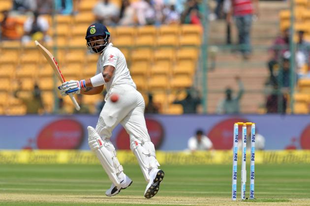 India cricket team captain Virat Kohli started off solidly, knocking a couple of boundaries. But he soon fell, trapped LBW by Nathan Lyon on Day 1 of the second Test at M Chinnaswamy Stadium in Bangalore on Saturday. (AFP) India cricket team captain Virat Kohli started off solidly, knocking a couple of boundaries. But he soon fell, trapped LBW by Nathan Lyon on Day 1 of the second Test at M Chinnaswamy Stadium in Bangalore on Saturday. (AFP)
