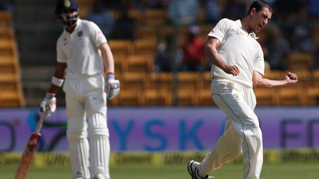 Australia cricket team's Mitchell Starc celebrates the wicket of Indian opener Abhinav Mukund, who was a late replacement for the injured Murali Vijay. Australia bowlers went on to take wickets at regular intervals, wresting control of the second Test at M Chinnaswamy Stadium on Saturday. (REUTERS) Australia cricket team's Mitchell Starc celebrates the wicket of Indian opener Abhinav Mukund, who was a late replacement for the injured Murali Vijay. Australia bowlers went on to take wickets at regular intervals, wresting control of the second Test at M Chinnaswamy Stadium on Saturday. (REUTERS)