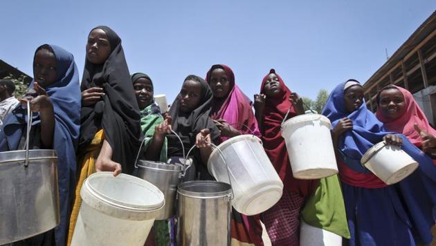 In this photo taken Saturday, Feb. 25, 2017, displaced Somali girls who fled the drought in southern Somalia stand in a queue to receive food handouts at a feeding center in a camp in Mogadishu, Somalia. (AP Photo) In this photo taken Saturday, Feb. 25, 2017, displaced Somali girls who fled the drought in southern Somalia stand in a queue to receive food handouts at a feeding center in a camp in Mogadishu, Somalia. (AP Photo)