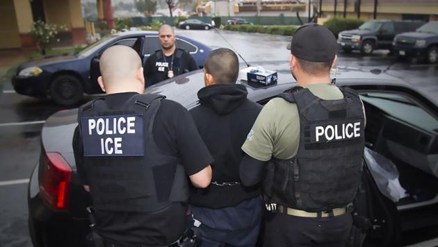 US Immigration and Customs Enforcement (ICE) officers detaining a suspect during an enforcement operation on February 7, 2017 in Los Angeles, California. (AFP File) US Immigration and Customs Enforcement (ICE) officers detaining a suspect during an enforcement operation on February 7, 2017 in Los Angeles, California. (AFP File)