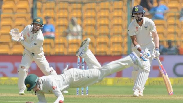India cricket team’s KL Rahul (right) was the only batsmen who could resist and attack the Australian spinners -- Nathan Lyon and Steve O’Keefe. But some tight Aussie fielding and tight bowling made his life hard in the middle on Day 1 of the second Test in Bangalore. (AFP) India cricket team’s KL Rahul (right) was the only batsmen who could resist and attack the Australian spinners -- Nathan Lyon and Steve O’Keefe. But some tight Aussie fielding and tight bowling made his life hard in the middle on Day 1 of the second Test in Bangalore. (AFP)