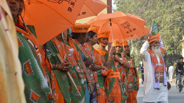 BJP supporters seen during the roadshow in support of their state assembly election party candidates in Varanasi. (Adarsh Gupta / HT PHOTO)