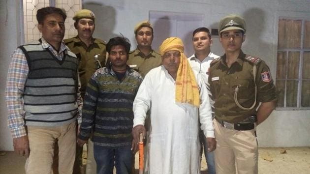Seventy-five-year-old Ram Snehi Lal (yellow turban) after his arrest. Lal is physically handicapped and posed as an astrologer.