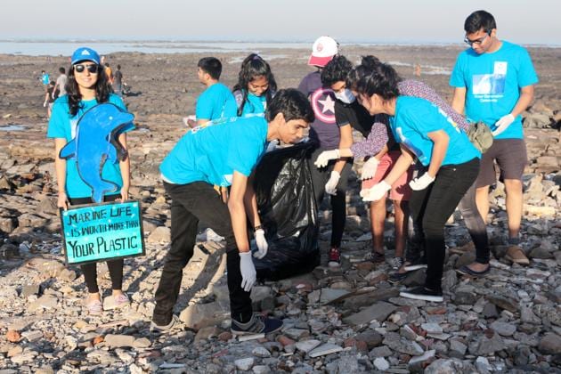 Students cleaning Chimbai beach at Bandra during a recent clean-up drive(HT photo)