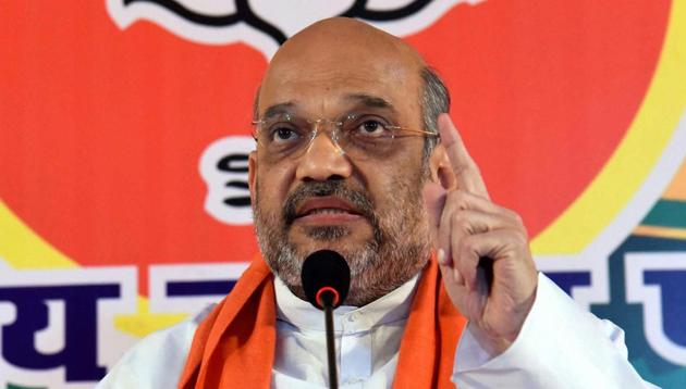 BJP president Amit Shah addesses a press conference in Varanasi on Friday.(PTI File)