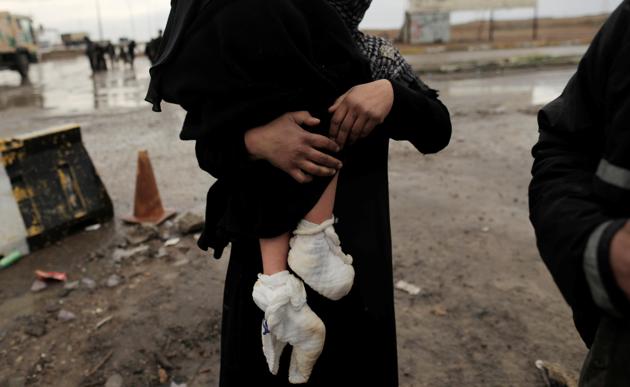 A displaced Iraqi woman carries her injured daughter after fleeing their home as Iraqi forces battle with Islamic State militants in western Mosul. The UN, which has been providing shelter, food and other assistance to Iraqis who have fled Mosul during the nearly five-month-long battle, said it is working as fast as possible to help those displaced. (Zohra Bensemra/REUTERS) A displaced Iraqi woman carries her injured daughter after fleeing their home as Iraqi forces battle with Islamic State militants in western Mosul. The UN, which has been providing shelter, food and other assistance to Iraqis who have fled Mosul during the nearly five-month-long battle, said it is working as fast as possible to help those displaced. (Zohra Bensemra/REUTERS)