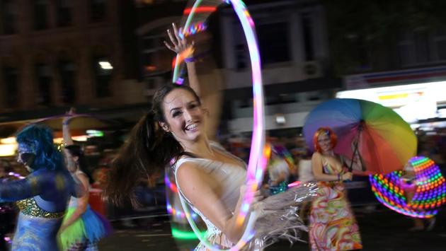 A woman dances with a hulk hoop. The event grew out of a political protest in 1978 and is now one of the biggest of its kind in the world. (Steven Saphore/REUTERS) A woman dances with a hulk hoop. The event grew out of a political protest in 1978 and is now one of the biggest of its kind in the world. (Steven Saphore/REUTERS)