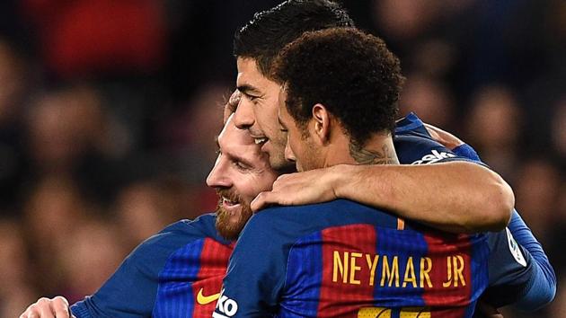 FC Barcelona's Lionel Messi (left) celebrates a goal with teammates Neymar (right) and Luis Suarez during their Spanish La Liga match against RC Celta de Vigo at Camp Nou on Saturday. (AFP) FC Barcelona's Lionel Messi (left) celebrates a goal with teammates Neymar (right) and Luis Suarez during their Spanish La Liga match against RC Celta de Vigo at Camp Nou on Saturday. (AFP)