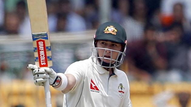 Matt Renshaw raises his bat to celebrate his fifty during the second day of their second Test against India in Bangalore on Sunday. (AP) Matt Renshaw raises his bat to celebrate his fifty during the second day of their second Test against India in Bangalore on Sunday. (AP)