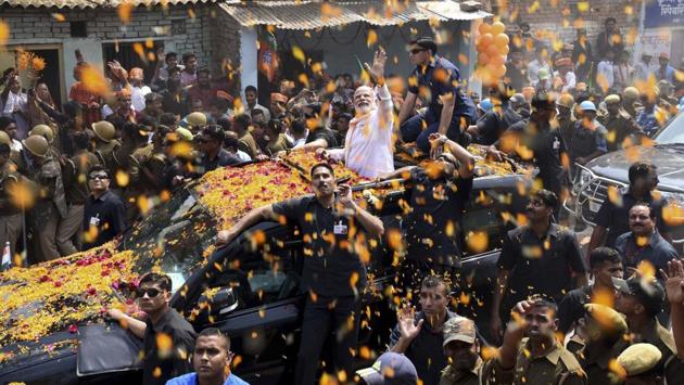 Prime Minister Narendra Modi waves at the crowd during the road show in Varanasi on March 4, 2017. (Arun Sharma/HT PHOTO) Prime Minister Narendra Modi waves at the crowd during the road show in Varanasi on March 4, 2017. (Arun Sharma/HT PHOTO)