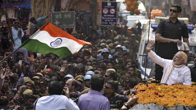 Prime Minister Narendra Modi waves at his supporters during the road show in Varanasi. (Arun Sharma/HT PHOTO) Prime Minister Narendra Modi waves at his supporters during the road show in Varanasi. (Arun Sharma/HT PHOTO)