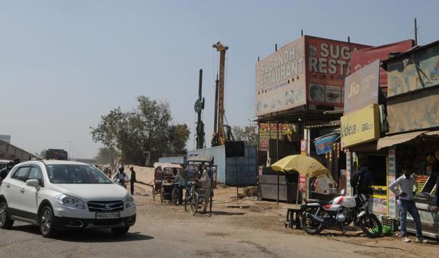 Work on an underpass at Hero Honda Chowk is stuck over the issue of relocating the Sugandh restaurant.(Parveen Kumar/HT PHOTO)