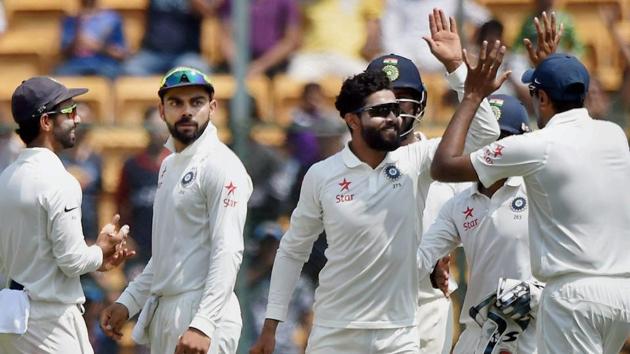 India's Ravindra Jadeja with team mates celebrate the wicket of Australia's Steve Smith during the second day of Bangalore Test. (PTI) India's Ravindra Jadeja with team mates celebrate the wicket of Australia's Steve Smith during the second day of Bangalore Test. (PTI)