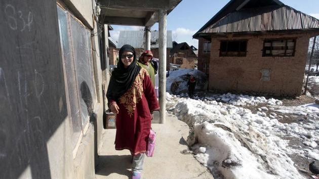 Insha Mushtaq, a girl blinded by pellets, went to school on Thursday, a day after schools in Kashmir reopened after winter vacations and normal classes began after eight months.(Waseem Andrabi / HT Photo)