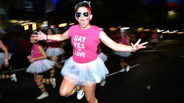 People take part in the annual Gay and Lesbian Mardi Gras parade in Sydney. Heralded by many in Australia as a pioneer for inclusivity in a traditionally male-dominated sport, Sydney’s women’s Aussie Rules league paraded a float with the message that there is ‘no place for discrimination in sport.’ (Peter Parks/AFP) People take part in the annual Gay and Lesbian Mardi Gras parade in Sydney. Heralded by many in Australia as a pioneer for inclusivity in a traditionally male-dominated sport, Sydney’s women’s Aussie Rules league paraded a float with the message that there is ‘no place for discrimination in sport.’ (Peter Parks/AFP)