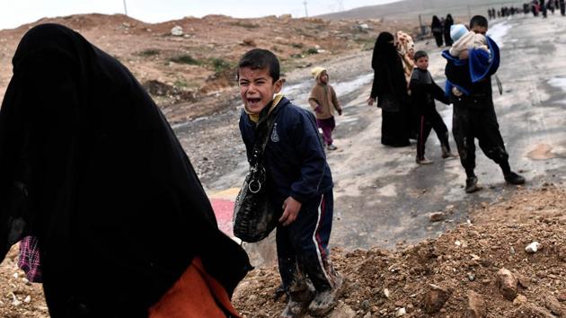 An Iraqi boy cries as families walk down a road while fleeing Mosul. More than 190,000 people are currently displaced as a result of the battle for Mosul, while more fled but have since returned to their homes, according to the International Organisation for Migration. (Aris Messinis/AFP) An Iraqi boy cries as families walk down a road while fleeing Mosul. More than 190,000 people are currently displaced as a result of the battle for Mosul, while more fled but have since returned to their homes, according to the International Organisation for Migration. (Aris Messinis/AFP)