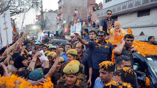Prime Minister Narendra Modi waves to supporters during the roadshow in Varanasi. he has been campaigning in the ancient city for three days. (Adarsh Gupta/Hindustan Times) Prime Minister Narendra Modi waves to supporters during the roadshow in Varanasi. he has been campaigning in the ancient city for three days. (Adarsh Gupta/Hindustan Times)