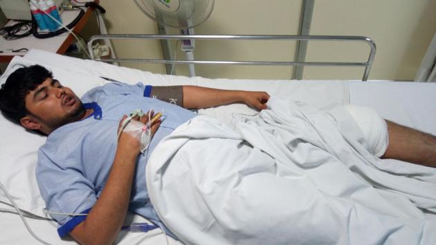 24-year-old Abhishek Mishra recuperating at Kailash Hospital in Noida on Monday. He was shot on his left leg.(HT Photo) 24-year-old Abhishek Mishra recuperating at Kailash Hospital in Noida on Monday. He was shot on his left leg.(HT Photo)