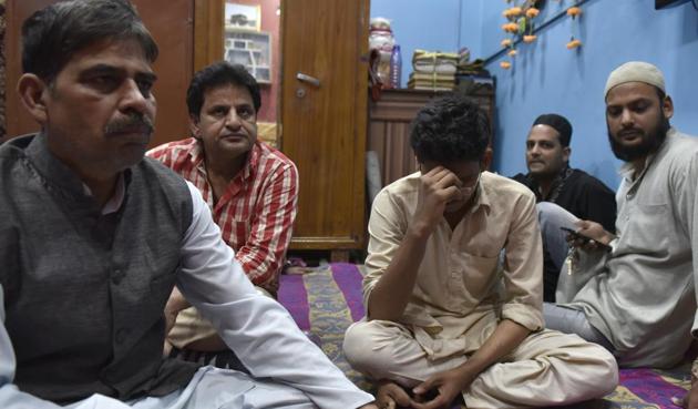 The family of Ayyub Sheikh, a first year BA student who got electrocuted atop a train at Nizamuddin on Monday. (Saumya Khandelwal/HT Photo) The family of Ayyub Sheikh, a first year BA student who got electrocuted atop a train at Nizamuddin on Monday. (Saumya Khandelwal/HT Photo)