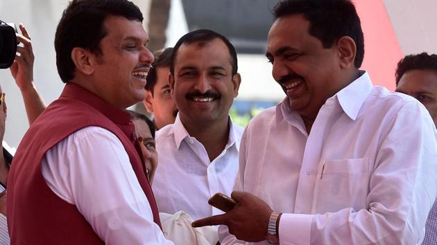 Chief minister Devendra Fadnavis and NCP MLA Jayant Patil share a light moment on the first day of the Budget session of the Maharashtra Assembly in Mumbai. (Kunal Patil/HT Photo)