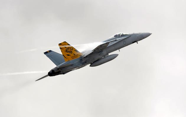 A Royal Australian Air Force F/A-18 Hornet aircraft flies during the Australian International Airshow. (MAL FAIRCLOUGH / AFP) A Royal Australian Air Force F/A-18 Hornet aircraft flies during the Australian International Airshow. (MAL FAIRCLOUGH / AFP)
