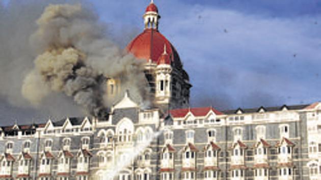 The Taj Mahal Palace Hotel on fire during the 2008 attacks in Mumbai. More than 160 people, including several foreigners, were killed.(HT file photo)